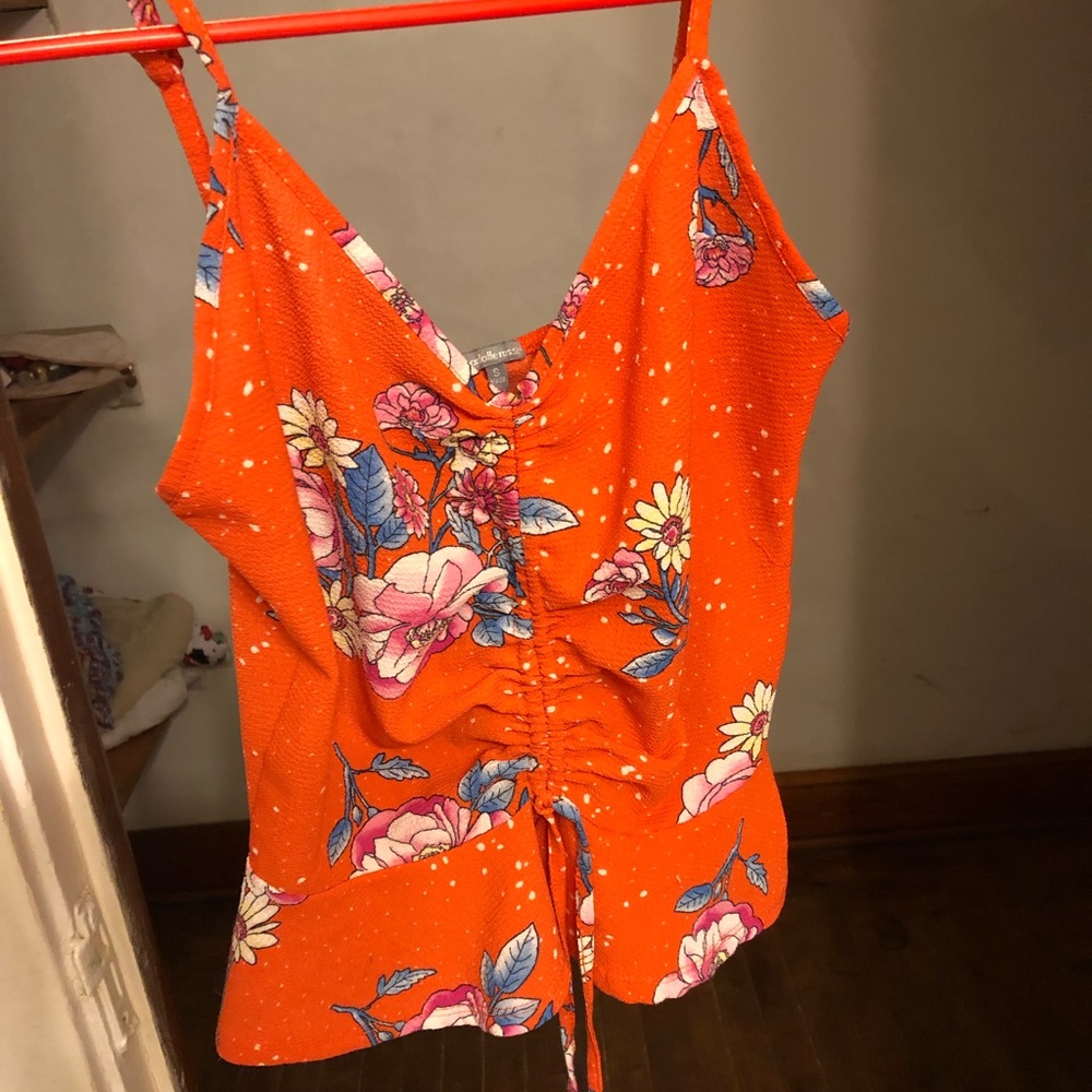 Orange floral tank top. Drawstring ribbed center